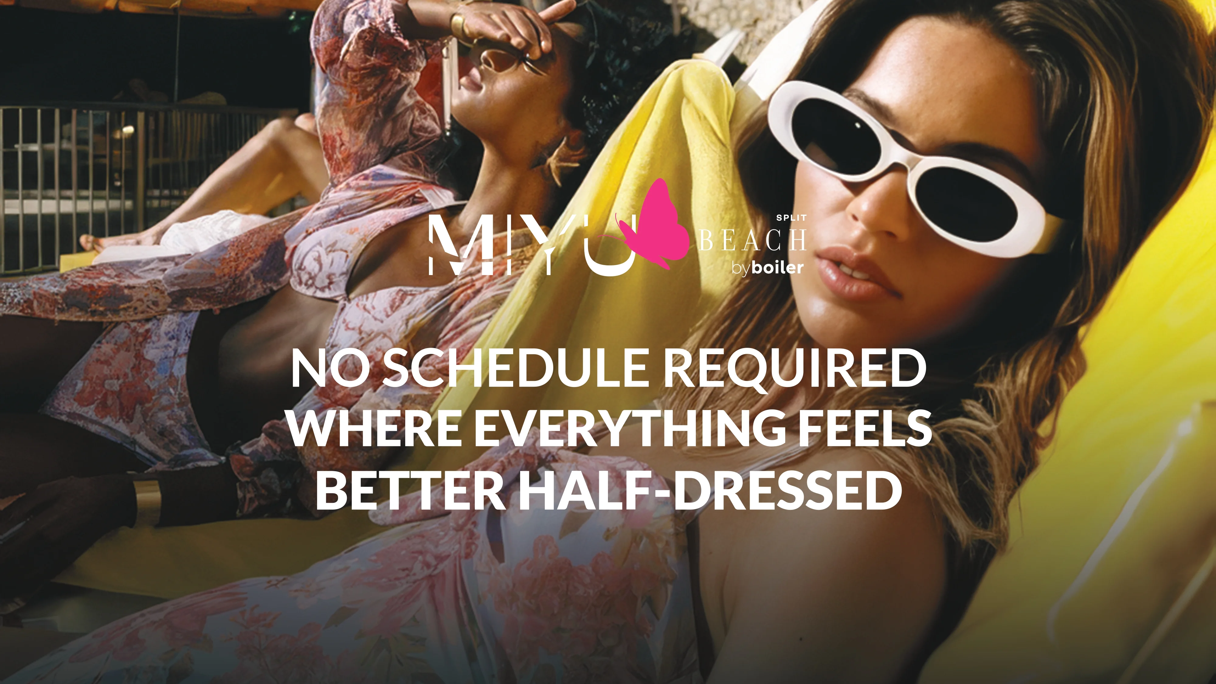 Two women relaxing on lounge chairs wearing sunglasses at Miyu Beach with a laid-back beach club atmosphere.
